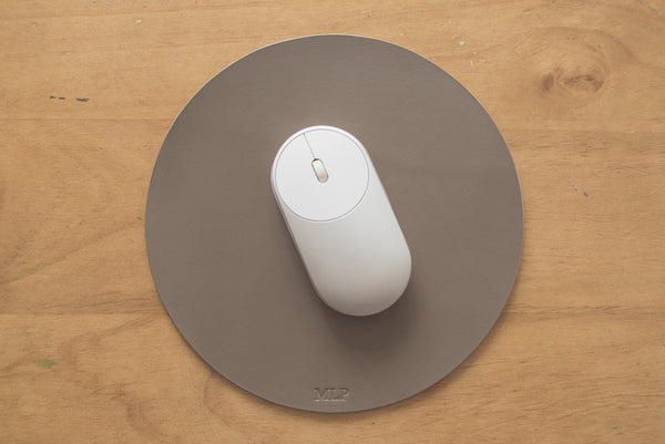 khaki/grey round leather mouse pad